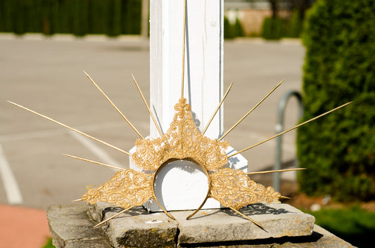 gold goddess spiked crown in the sun